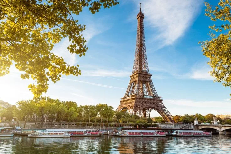 The Eiffel Tower against a cloudy sky
