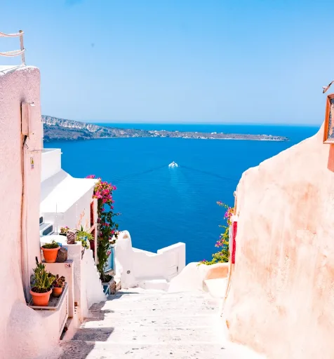 Whitewashed steps leading down to a blue sea
